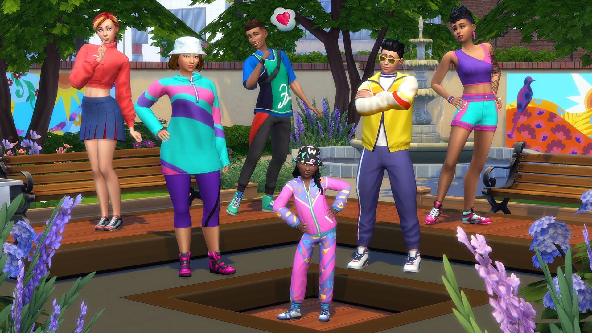 The Sims household of five Sims in colorful athletic wear posing together in a park with fountain and trees.