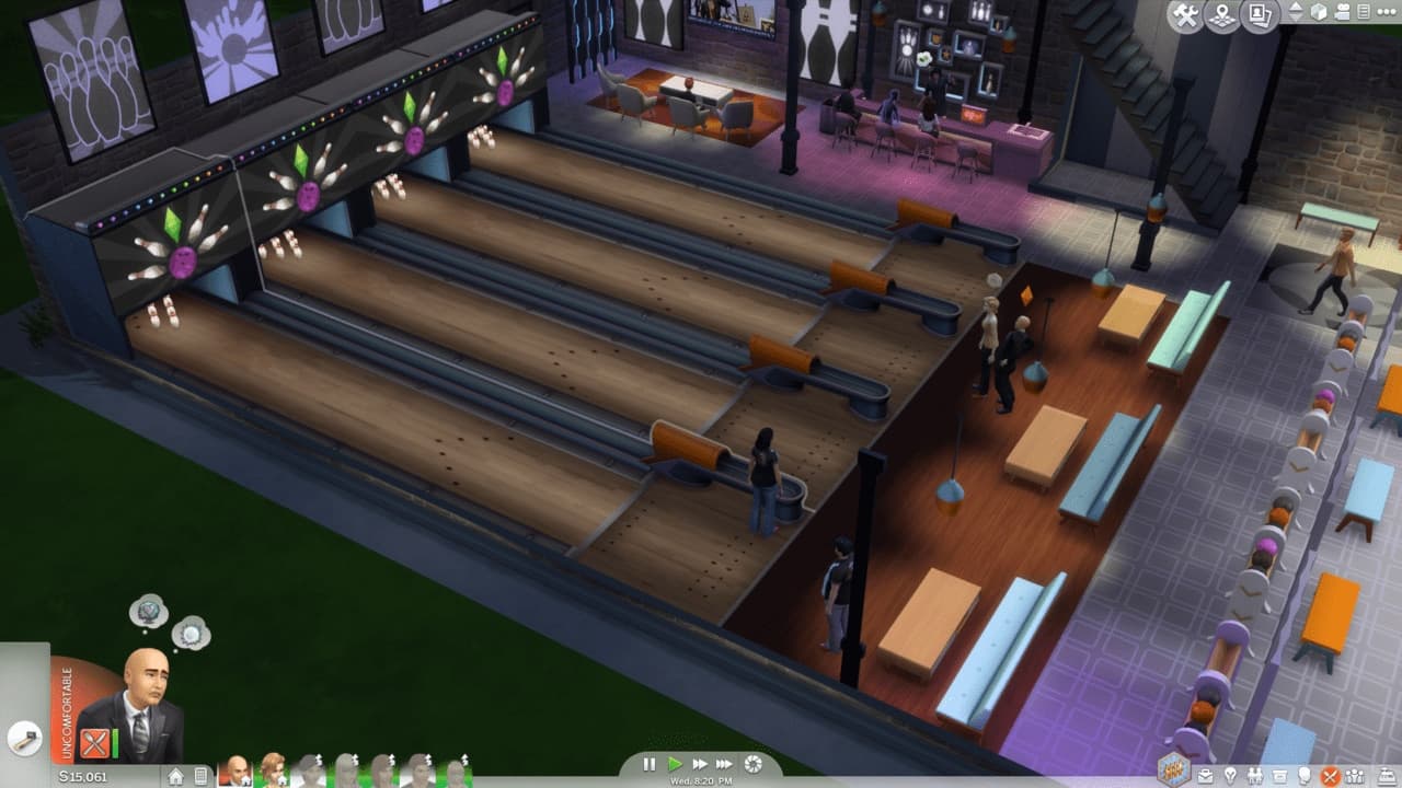 The Sims: lotto commerciale con piste da bowling, Sims e area bar in vista dall'alto.